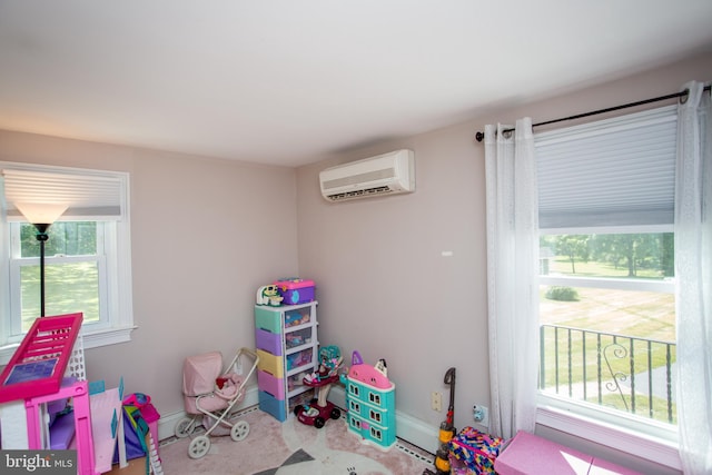 game room with a wall mounted air conditioner and carpet flooring