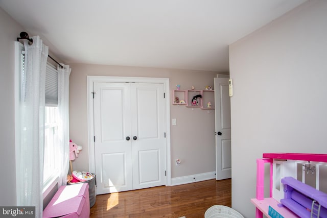 bedroom featuring hardwood / wood-style flooring and a closet