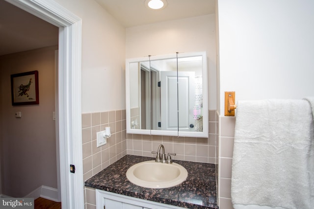 bathroom featuring backsplash and vanity