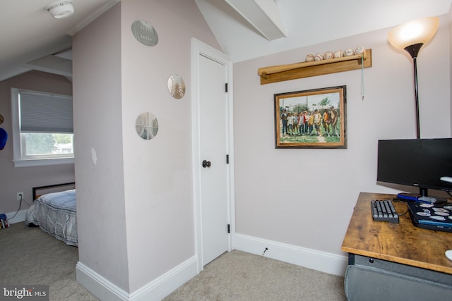 office area featuring vaulted ceiling and light carpet