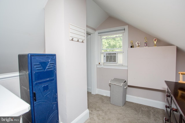 interior space with cooling unit, light colored carpet, and lofted ceiling