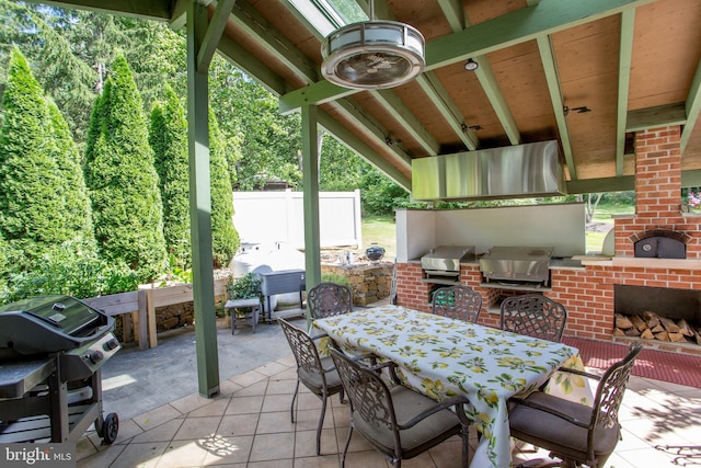 view of patio featuring exterior kitchen and area for grilling