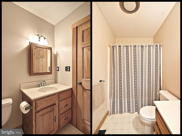 bathroom with a textured ceiling, vanity, and toilet