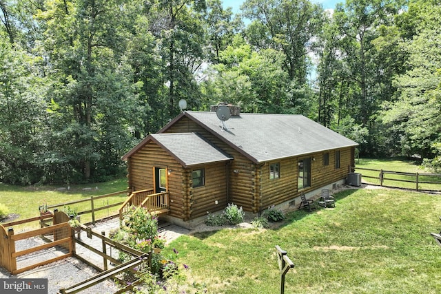 exterior space featuring a yard and cooling unit