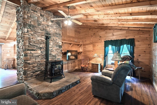 living room featuring a wood stove, wooden ceiling, vaulted ceiling with beams, dark hardwood / wood-style flooring, and wooden walls