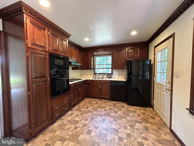 kitchen featuring sink, black appliances, and ornamental molding