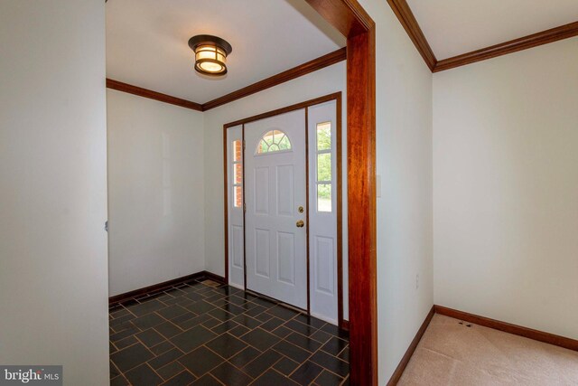 entrance foyer featuring ornamental molding