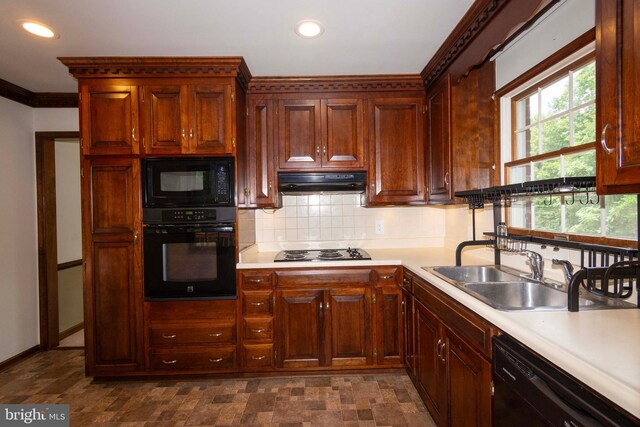 kitchen with decorative backsplash, sink, black appliances, and crown molding