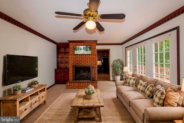 carpeted living room with ceiling fan and a brick fireplace