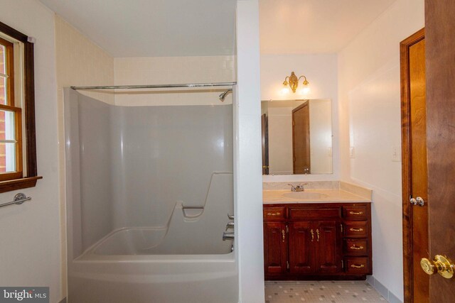 bathroom featuring vanity and shower / washtub combination