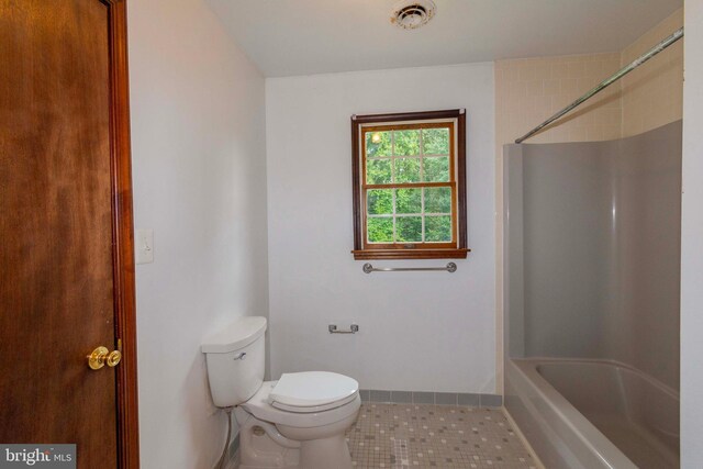 bathroom featuring toilet and tile patterned floors