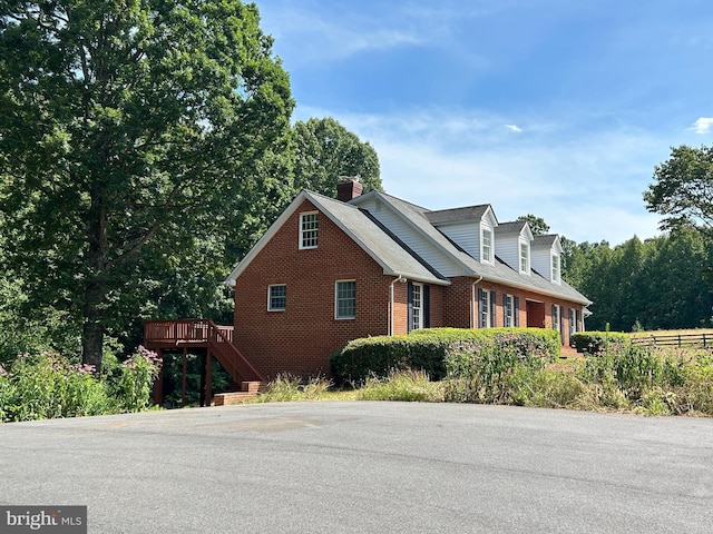 view of property exterior featuring a deck