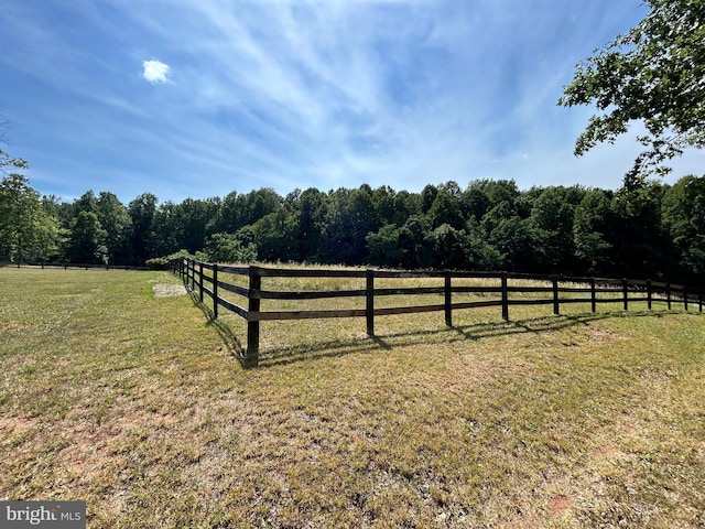 view of yard with a rural view