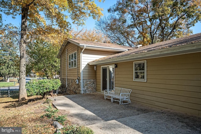 rear view of property featuring a patio area