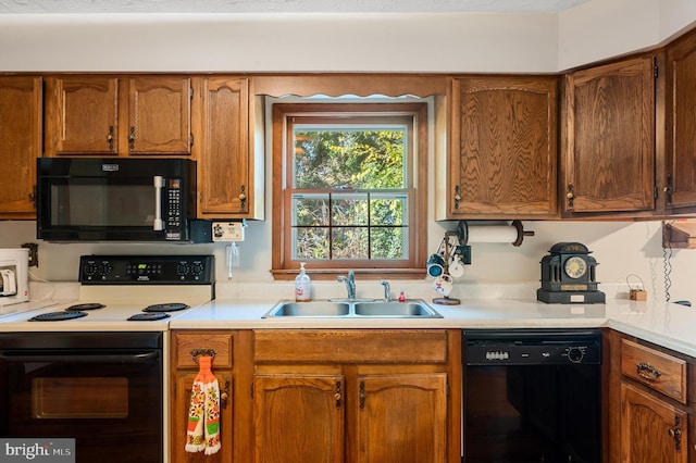 kitchen featuring sink and black appliances