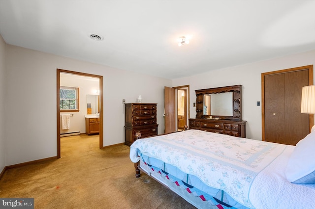 carpeted bedroom featuring connected bathroom and a baseboard radiator