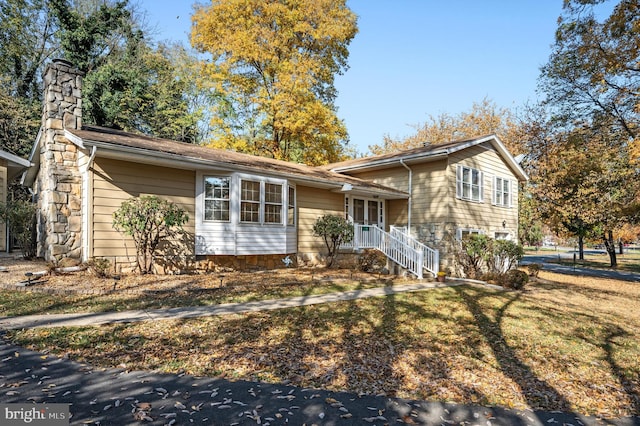 split level home with a front yard