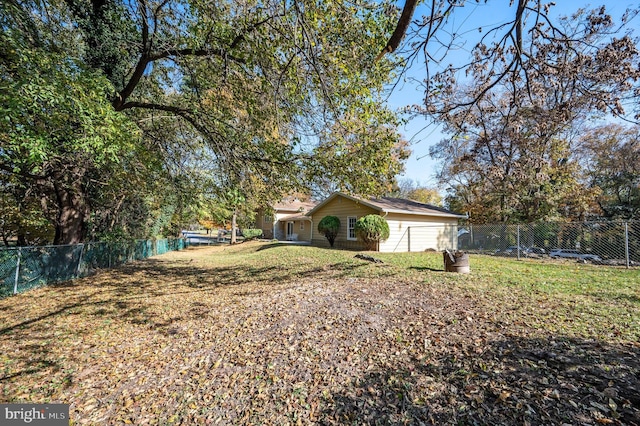 view of side of home featuring a yard