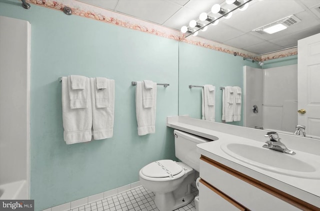 bathroom with tile patterned flooring, vanity, and toilet