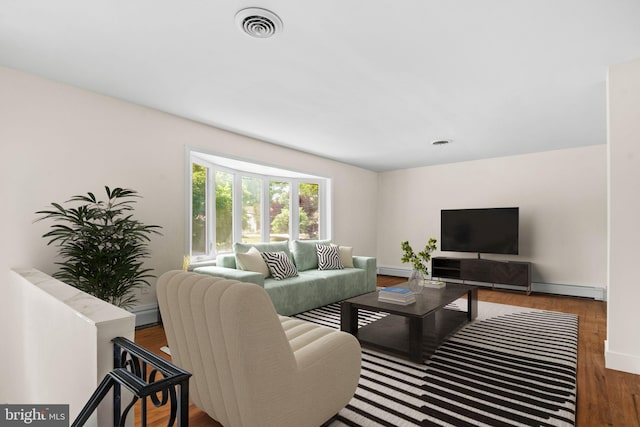 living room featuring dark hardwood / wood-style floors