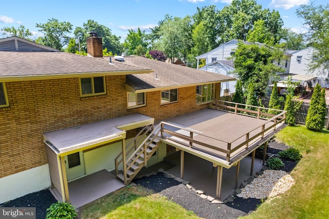 back of property with a wooden deck