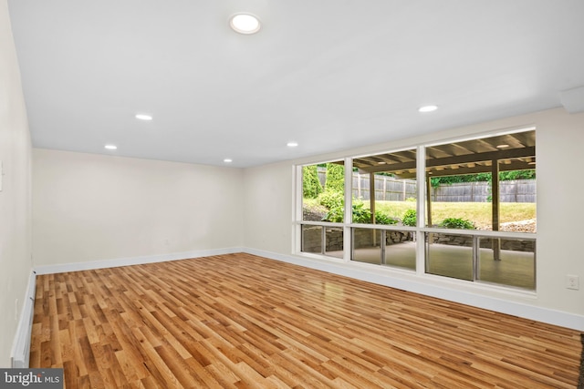 empty room with light hardwood / wood-style floors