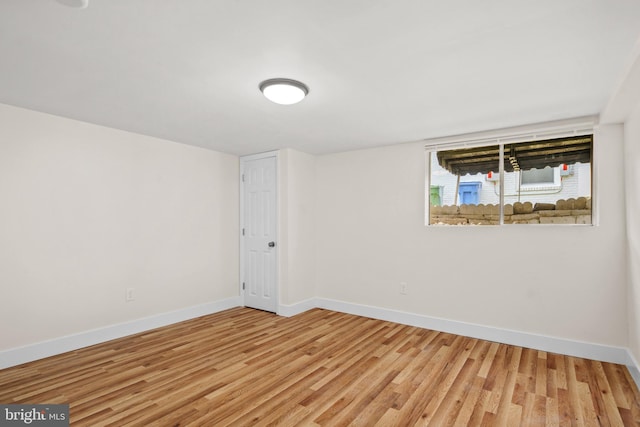 spare room with hardwood / wood-style floors