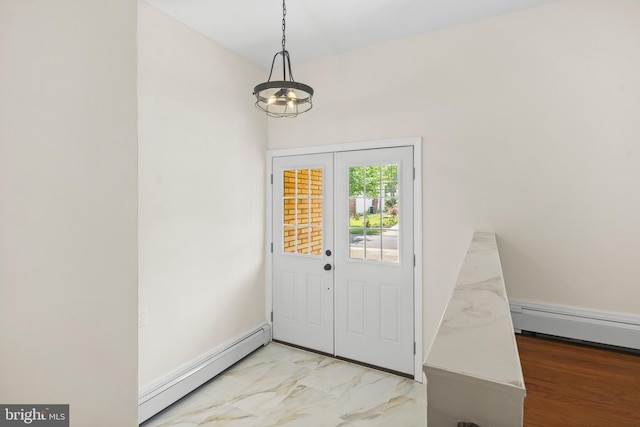 foyer with a chandelier and baseboard heating