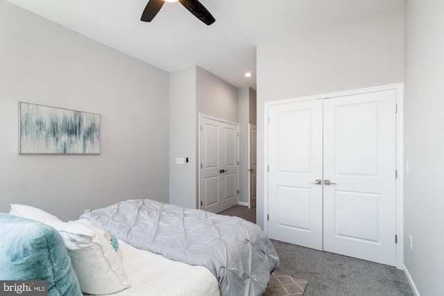 carpeted bedroom with a closet and ceiling fan