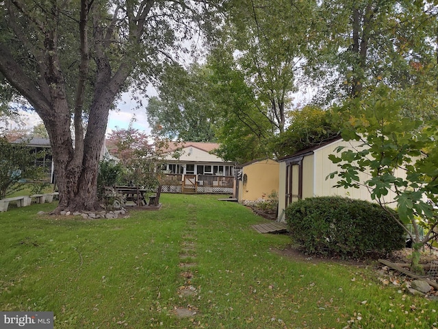 view of yard with a wooden deck