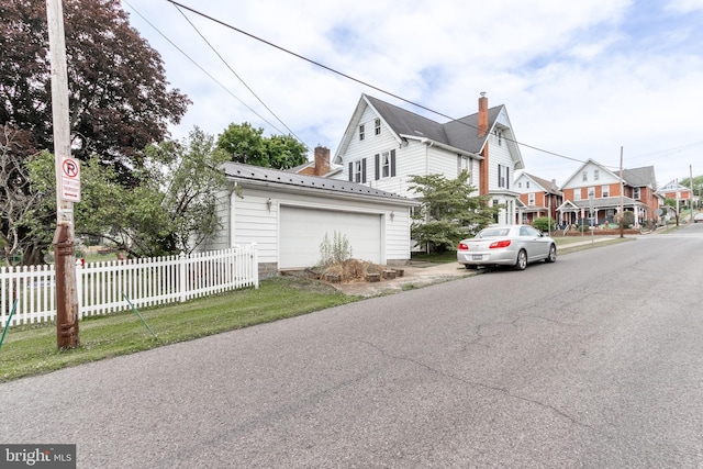 view of side of home with a garage