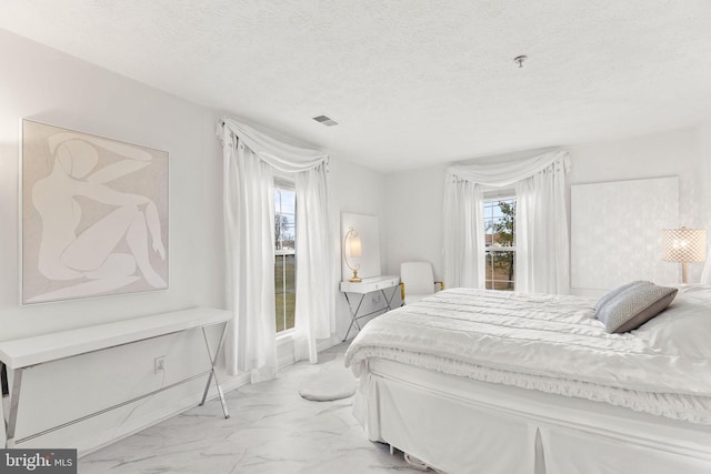 bedroom with a textured ceiling