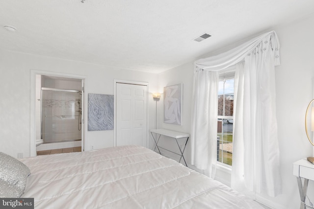 bedroom with connected bathroom