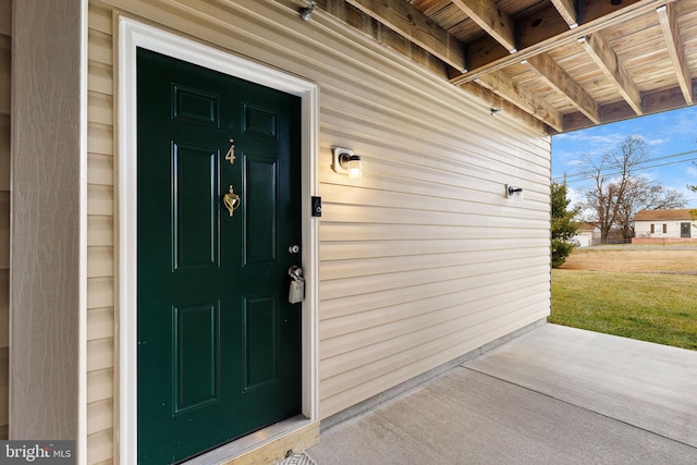 doorway to property featuring covered porch