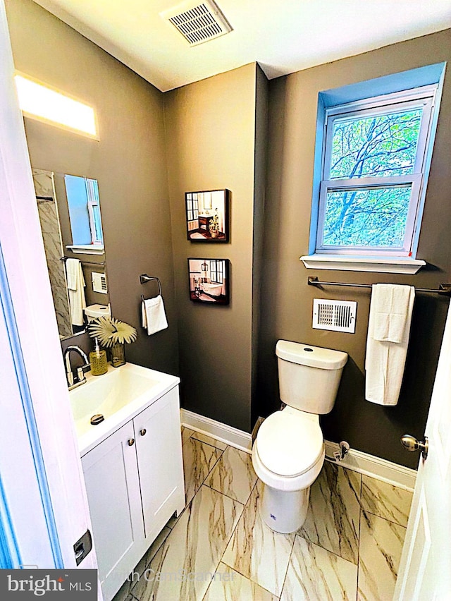 bathroom with vanity and toilet