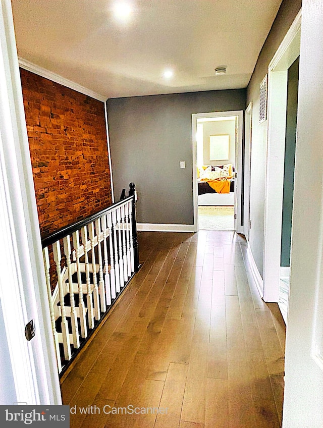 corridor with wood-type flooring