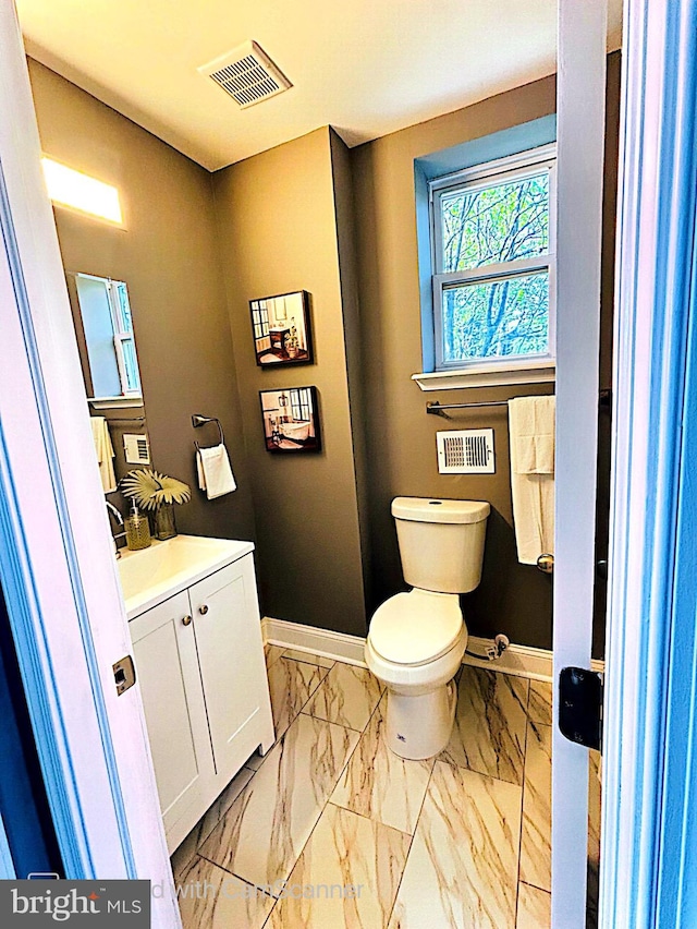 bathroom with vanity and toilet