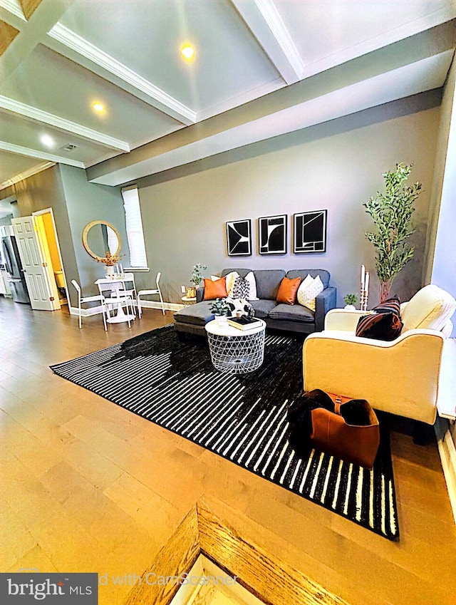 living room featuring ornamental molding, hardwood / wood-style floors, and beam ceiling