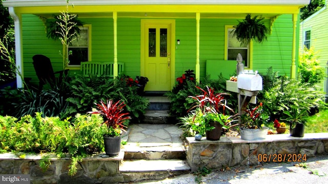 entrance to property with covered porch