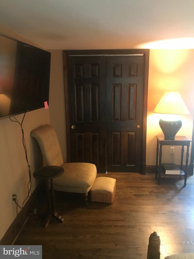 living area with wood-type flooring