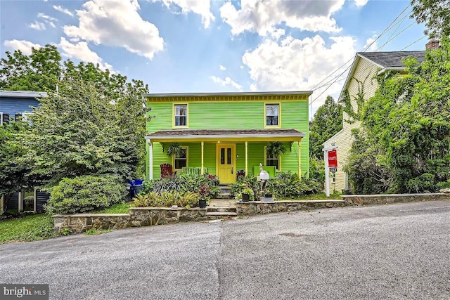 front of property featuring covered porch