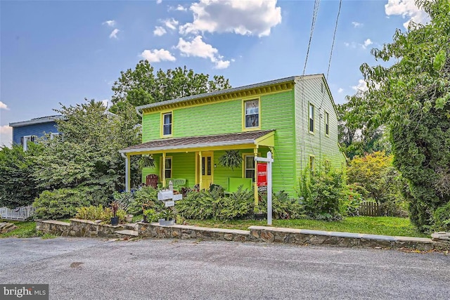 view of property with covered porch