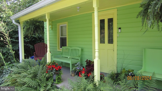 entrance to property with covered porch