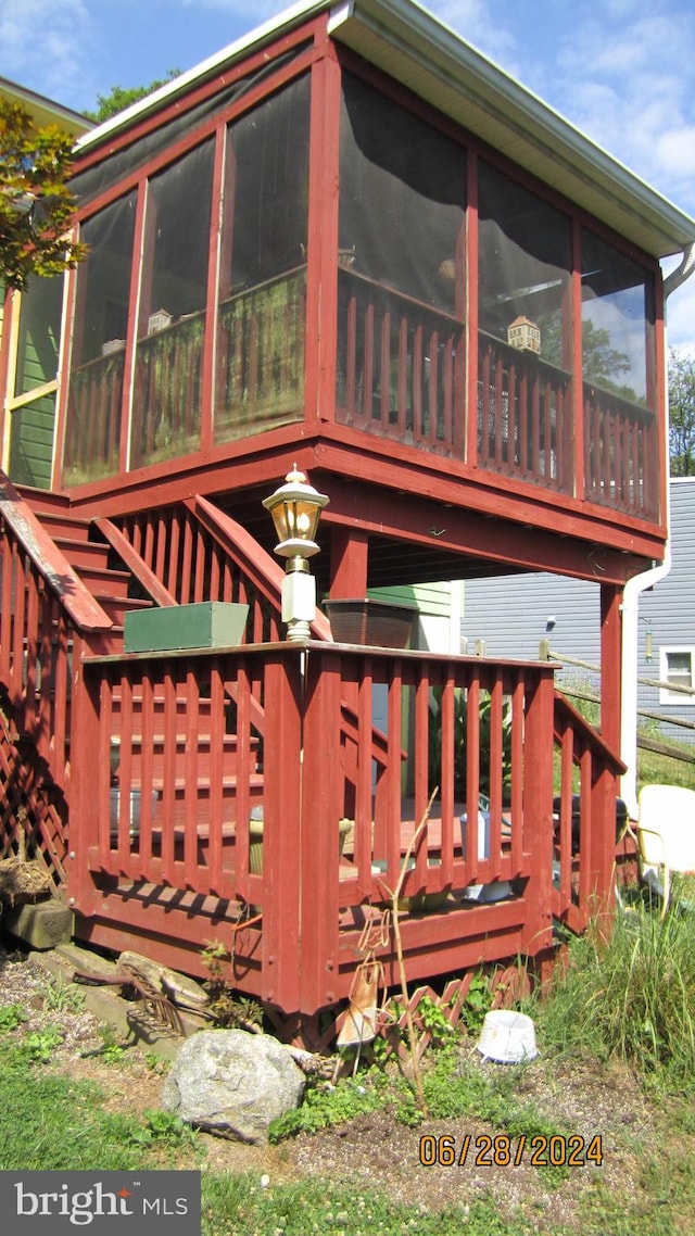 deck featuring a sunroom