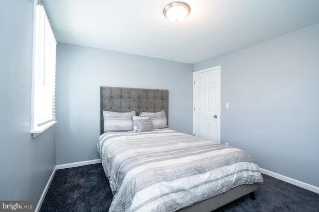 carpeted bedroom with baseboards