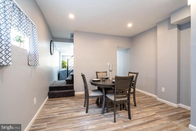 dining area featuring stairway, recessed lighting, light wood-style flooring, and baseboards