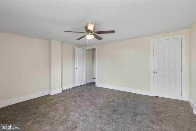 unfurnished room with carpet and ceiling fan