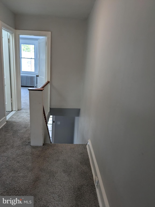 stairs with carpet and radiator heating unit