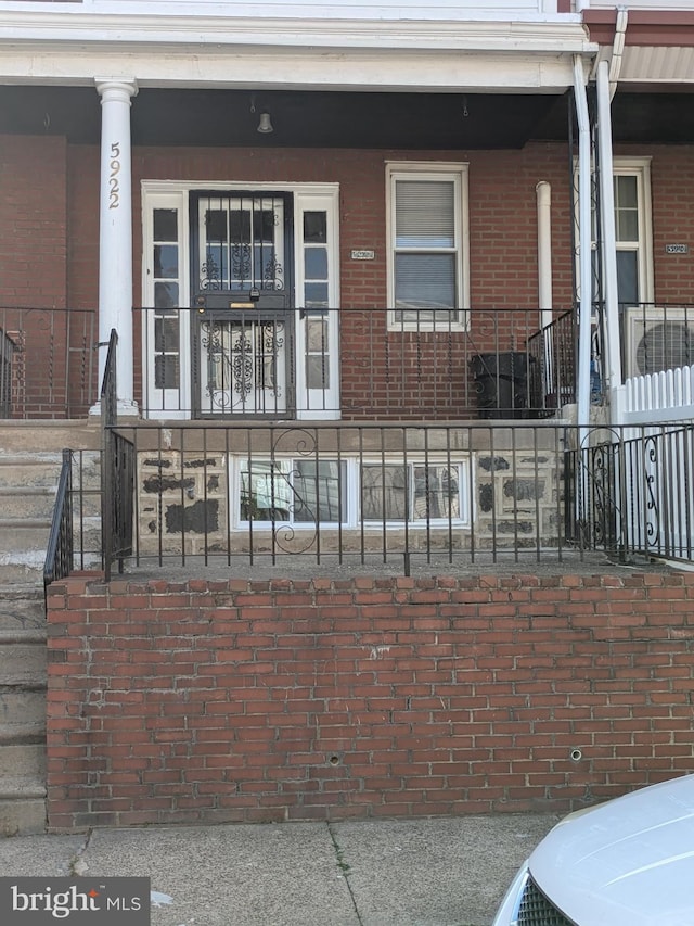 entrance to property with covered porch