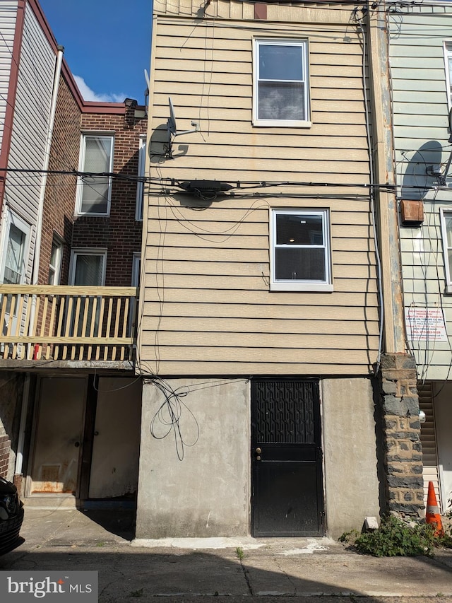 view of side of property with a balcony